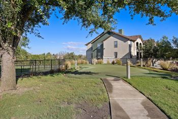 A golf course in front of a house